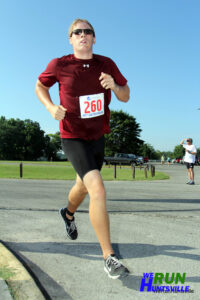 Runner in red shirt during a race.