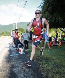 Athlete running in a triathlon race.