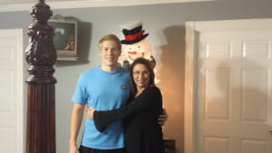 Man and woman hugging in a room.